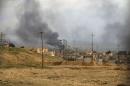 A general view shows the town of Sinjar as smoke rises from what activists said were U.S.-led air strikes