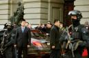Chinese President Xi Jinping waves as he leaves the Bundeshaus in Bern