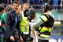 Inter Milan's coach Andrea Stramaccioni (L) smiles after his team won the match