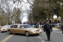 A long line of limos follow the hearse carrying the body of Whitney Houston arrives at Fairview Cemetery for her burial in Westfield, N.J., Sunday, Feb. 19, 2012. (AP Photo/Rich Schultz)