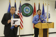 Brownsville city manager Charlie Cabler, left, holds up a photo of the carbon dioxide powered pellet handgun 15-year-old Jaime Gonzalez was holding at the time he was shot by police at Cummings Middle School as Police Chief Orlando Rodriguez speaks during a news conference Wednesday, Jan. 4, 2012 in Brownsville, Texas. (AP Photo/The Brownsville Herald, Yvette Vela)