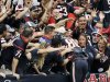Houston Texans wide receiver Andre Johnson (80) dives into the crowd after scoring the winning touchdown against the Jacksonville Jaguars in overtime of an NFL football game, Sunday, Nov. 18, 2012, in Houston. The Texans won 43-37. (AP Photo/Dave Einsel)