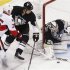 Pittsburgh Penguins goalie Fleury blocks a shot by Otttawa Senators' Neil as Penguins' Engelland tries to defend in their NHL hockey game in Pittsburgh