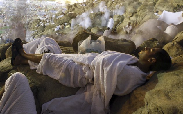 A Muslim pilgrim sleeps while …