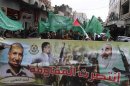 Palestinians wave Hamas flags during a rally celebrating what they claim to be Hamas' victory over Israel in the Gaza conflict, in Ramallah