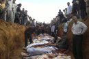 This citizen journalist image obtained by the Associated Press on Friday, April 6, 2012, shows a mass burial of people allegedly killed in recent shelling in Taftanaz, Syria. (AP Photo) THE ASSOCIATED PRESS CANNOT INDEPENDENTLY VERIFY THE CONTENT, DATE, LOCATION OR AUTHENTICITY OF THIS MATERIAL