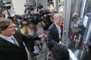 Former Virginia Gov. Bob McDonnell, right, arrives at federal court with his attorney, Henry Asbill, left, Wednesday, Aug. 20, 2014, in Richmond, Va. The defense continues to present its case in McDonnell's corruption case. (AP Photo/Steve Helber)