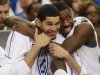 Kentucky's Eloy Vargas, left, and Michael Kidd-Gilchrist reacts in the closing seconds of the NCAA tournament South Regional final college basketball game against Baylor on Sunday, March 25, 2012, in Atlanta. Kentucky won 82-70. (AP Photo/John Bazemore)