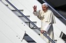 Pope Benedict XVI waves as he boards a plane on his way to a six-day visit to Mexico and Cuba, at Rome's Fiumicino international airport, Friday, March 23, 2012. (AP Photo/Andrew Medichini)