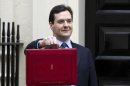 Britain's Chancellor of the Exchequer George Osborne poses for the media with his traditional red dispatch box outside his official residence at No 11 Downing Street in London, as he departs to deliver his annual budget speech to the House of Commons, Wednesday, March 21, 2012. Later on Wednesday, George Osborne, the U.K.'s finance minister, will unveil his budget, the annual update of the state of the country's economy and the coalition government's plans for taxation and spending for the year. This time round, attention has focused on what Osborne is going to do with the 