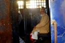Bangladesh leader of the Jamaat-e-Islami party, Motiur Rahman Nizami, 70, sits inside a prison van following sentencing at a court in Chittagong on January 30, 2014