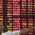 An investor gestures in front of the stock price monitor at a private securities company in Shanghai, China, Wednesday Sept. 5, 2012. Weaker-than-expected U.S. manufacturing figures, just days after China announced its own production slowdown, sent Asian stock markets down Wednesday. (AP Photo)