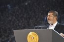 Egypt's President Mohamed Mursi speaks to the nation at Cairo stadium