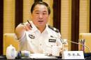 Then vice minister of public security Li Dongsheng gestures as he speaks during a meeting in Nanjing