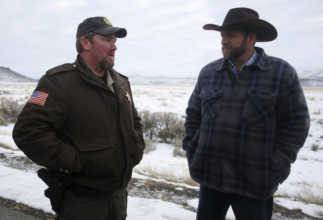 Ammon Bundy (right) meets with Harney County Sheriff David Ward along a road south of the Malheur National Wildlife Refuge near Burns, Oregon, January...