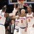 New York Knicks' Carmelo Anthony (7) high fives team mates Raymond Felton (2) Jason Kidd (5) and J.R. Smith (8) during the first half of an NBA basketball game against the Washington Wizards, Tuesday, April 9, 2013, at Madison Square Garden in New York.  (AP Photo/Mary Altaffer)