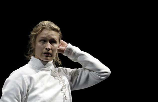 Germany's Heidemann reacts as she competes against South Korea's Shin during their women's epee individual semifinal fencing competition at the ExCel venue at the London 2012 Olympic Games