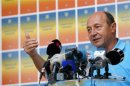 Romania's suspended President Traian Basescu addresses the media in Bucharest