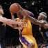 Los Angeles Lakers guard Kobe Bryant, middle, tries to drive though Denver Nuggets' Danilo Gallinari, left, and Al Harrington during the first half of Game 2 of an NBA basketball first-round playoff series, in Los Angeles on Tuesday, May 1, 2012. (AP Photo/Chris Carlson)