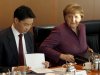 German Chancellor Angela Merkel, right, and German Economy Minister Philipp Roesler, left, attend the weekly cabinet meeting at the chancellery in Berlin, Germany, Wednesday, Jan. 18, 2012. (AP Photo/Michael Sohn)