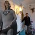 In this Thursday, Dec. 20, 2012, photo, Bernard Duval, innkeeper of the Aunt Bee's Little White House B&B, stands in the doorway by a cutout of President Barack Obama in a super hero outfit, at the B&B in Washington. The six-room bed and breakfast in northeast Washington still had two rooms available for the presidential inauguration as of the week before Christmas, with rates starting at $225 a night. (AP Photo/Jacquelyn Martin)