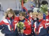 FILE - In this Feb. 22, 1994 file photo, American short track speedskating bronze medalists Nikki Ziegelmeyer, left, Karen Cashman, second from left, Cathy Turner and Amy Peterson, right, celebrate on the podium after receiving their medals for the 3,000-meter relay in Hamar, Norway. A second former U.S. speedskater has made sexual abuse accusations against Olympic medalist and former U.S. Speedskating President Andy Gabel, saying he raped her when she was 15. Nikki Meyer spoke Friday, March 8, 2013, in an interview with The Associated Press. She was known as Nikki Ziegelmeyer when she skated short track for the U.S. in the 1992 and 1994 Olympics. (AP Photo/Doug Mills, File)