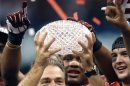File photo of Alabama Crimson Tide head coach Saban holding the BCS trophy after defeating the LSU Tigers in their NCAA BCS National Championship college football game in New Orleans
