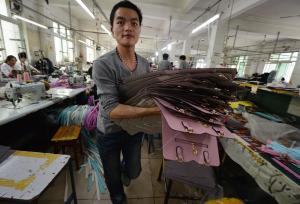 Workers at a handbag factory in Baigou, Hebei Province&nbsp;&hellip;