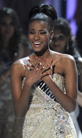 ALTERNATIVE CROP OF XAP114 - Miss Angola Leila Lopes reacts after being named Miss Universe 2011, before being crowned at the Miss Universe pageant in Sao Paulo, Brazil, Monday Sept. 12, 2011. (AP Photo/Andre Penner)