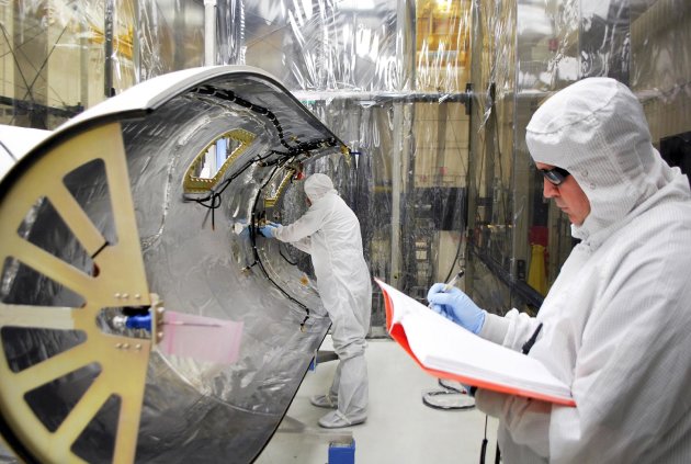 File-This undated image provided by NASA shows technicians preparing at Vandenberg Air Force Base, Calif. for the launch of NASA's latest satellite, Interface Region Imaging Spectrograph (IRIS), that will study the sun. The Iris satellite is set to ride into Earth orbit on a rocket, which will be dropped from an airplane flying over the Pacific some 100 miles off California's central coast Thursday June 27, 2013. (AP Photo/NASA,VAFB, Randy Beaudoin,File)