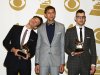 Members of fun., from left, Nate Ruess, Andrew Dost and Jack Antonoff, pose backstage with the song of the year award for "We Are Young" at the 55th annual Grammy Awards on Sunday, Feb. 10, 2013, in Los Angeles. (Photo by Matt Sayles/Invision/AP)