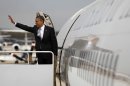 President Barack Obama waves as he boards Air Force One before his departure from Andrews Air Force Base, Md., Friday, March, 30, 2012. (AP Photo/Pablo Martinez Monsivais)