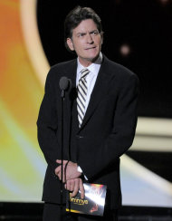 Charlie Sheen present the award for outstanding lead actor in a comedy series at the 63rd Primetime Emmy Awards on Sunday, Sept. 18, 2011 in Los Angeles. (AP Photo/Mark J. Terrill)