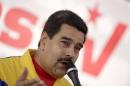 Venezuela's President Nicolas Maduro speaks in a news conference after voting in a polling center in Caracas