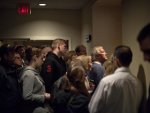 Crowds gather in the hallway outside a hotel ballroom as they try to catch a glimpse of Republican presidential candidate former Massachusetts Gov. Mitt Romney speaking during a campaign stop Friday ...