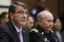 U.S. Defense Secretary Carter testifies next to U.S. Joint Chiefs Chairman General Dempsey before a House Armed Services Committee hearing in Washington