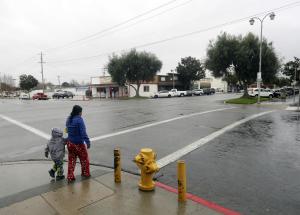 A woman and child cross an intersection on Wednesday,&nbsp;&hellip;