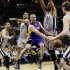 Los Angeles Lakers' Steve Blake, center, is surrounded by San Antonio Spurs', from left, Danny Green, Tony Parker, Tim Duncan and Tiago Splitter as he tries to drive to the basket during the first half of Game 1 of their first-round NBA playoff basketball series, Sunday, April 21, 2013, in San Antonio. (AP Photo/Eric Gay)