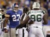 New York Giants' Brandon Jacobs (27) yells at New York Jets' Muhammad Wilkerson (96) as referees separate them during the third quarter of an NFL preseason football game, Monday, Aug. 29, 2011, in East Rutherford, N.J. Both players were ejected after taking swings at each other. (AP Photo/Julio Cortez)