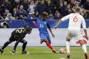 France's Kingsley Coman, 2nd left, scores his side's 4th goal past Russia's goalkeeper Igor Akinfeev during the international friendly soccer match between France and Russia in Saint Denis, north of Paris, France, Tuesday, March 29, 2016. (AP Photo/Thibault Camus)