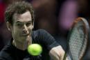 Britain's Andy Murray returns the ball to Nicolas Mahut of France during their first round match of the 42nd ABN AMRO world tennis tournament at Ahoy Arena in Rotterdam, Netherlands, Wednesday, Feb. 11, 2015. (AP Photo/Peter Dejong)