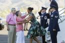 President Barack Obama and first lady Michelle Obama, are greeted on the tarmac by Sen. Barbara Boxer, D-Calif., second from left, and her husband Stewart Boxer, left, as they arrive on Friday, June 13, 2014, in Palm Springs, Calif. (AP Photo/Manuel Balce Ceneta)