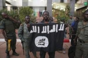 Malian security officials show a jihadist flag they&nbsp;&hellip;