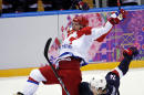 Russia forward Alexander Ovechkin is upended by USA forward T.J. Oshie in the third period of a men's ice hockey game at the 2014 Winter Olympics, Saturday, Feb. 15, 2014, in Sochi, Russia. (AP Photo/Petr David Josek)