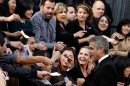 George Clooney arrives before the 84th Academy Awards on Sunday, Feb. 26, 2012, in the Hollywood section of Los Angeles. (AP Photo/Matt Sayles)