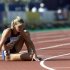 Suzy Favor-Hamilton of the U.S. sits on the track after a DNF in her heat of the 1500 meter semifina..
