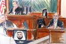 In this courtroom sketch Osama bin Laden's son-in-law, Sulaiman Abu Ghaith, right, testifies at his trial Wednesday, March 19, 2014, in New York, on charges he conspired to kill Americans and aid al-Qaida as a spokesman for the terrorist group. Listening to testimony are Judge Lewis Kaplan, upper left, and clerk Andrew Mohan, center left, as an image of Khalid Sheik Mohammed, the self-professed architect of the Sept. 11 attacks, appears on a video monitor. In his surprise testimony, Abu Ghaith recounted the night of the Sept. 11, 2001, attacks, when bin Laden sent a messenger to drive him into a mountainous area for a meeting inside a cave in Afghanistan. (AP Photo/Elizabeth Williams)
