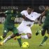 Ahmed Zuway of Libya challenges Cheikh MBengue and Mohamed Diamé of Senegal during their African Nations Cup Group A match in Bata