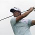 Scott of Australia tees off on ninth hole during the second round of the Barclays Singapore Open golf tournament in Sentosa
