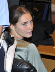 Amanda Knox attends an hearing of her appeals case at the Perugia court, Italy, Tuesday, Sept. 6, 2011. The police official who conducted the original investigation in the Amanda Knox case defended her standards Monday, after an independent review harshly criticized the evidence used to convict the American student of murdering her British roommate. Knox and her co-defendant and one-time boyfriend, Raffaele Sollecito, were convicted of sexually assaulting and killing Meredith Kercher in the apartment that Knox and the 21-year-old Briton shared while studying in Perugia. Knox was sentenced to 26 years in prison; Sollecito to 25. Both deny wrongdoing and have appealed the December 2009 verdict. (AP Photo/Stefano Medici)